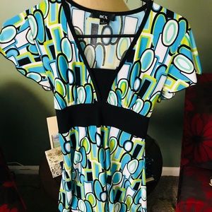 Business casual top. Geometric designs